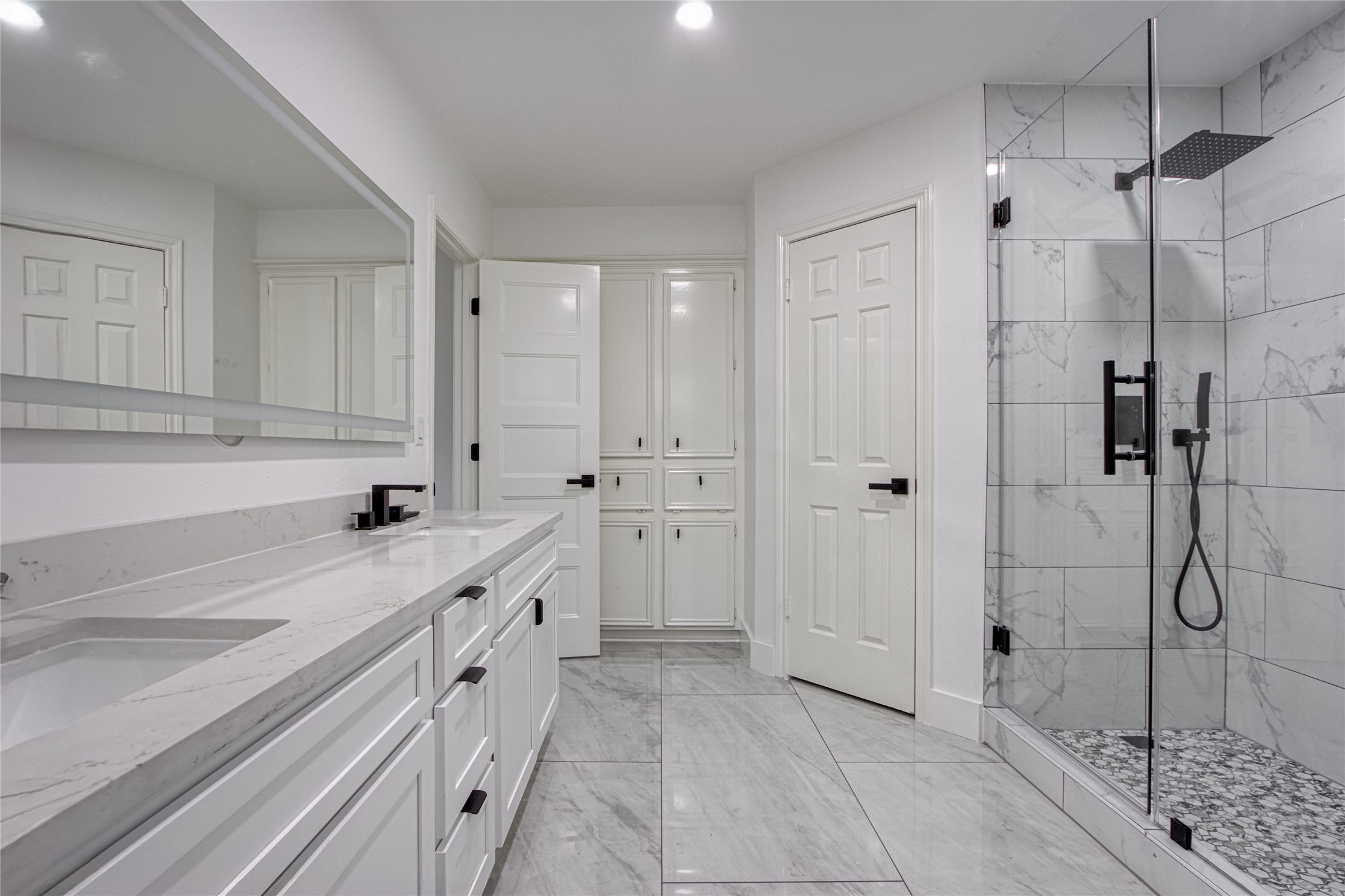 9211 Godstone Lane Spring, TX 77379 - Photo 20 of 30 a bathroom with a double vanity sink a toilet and shower