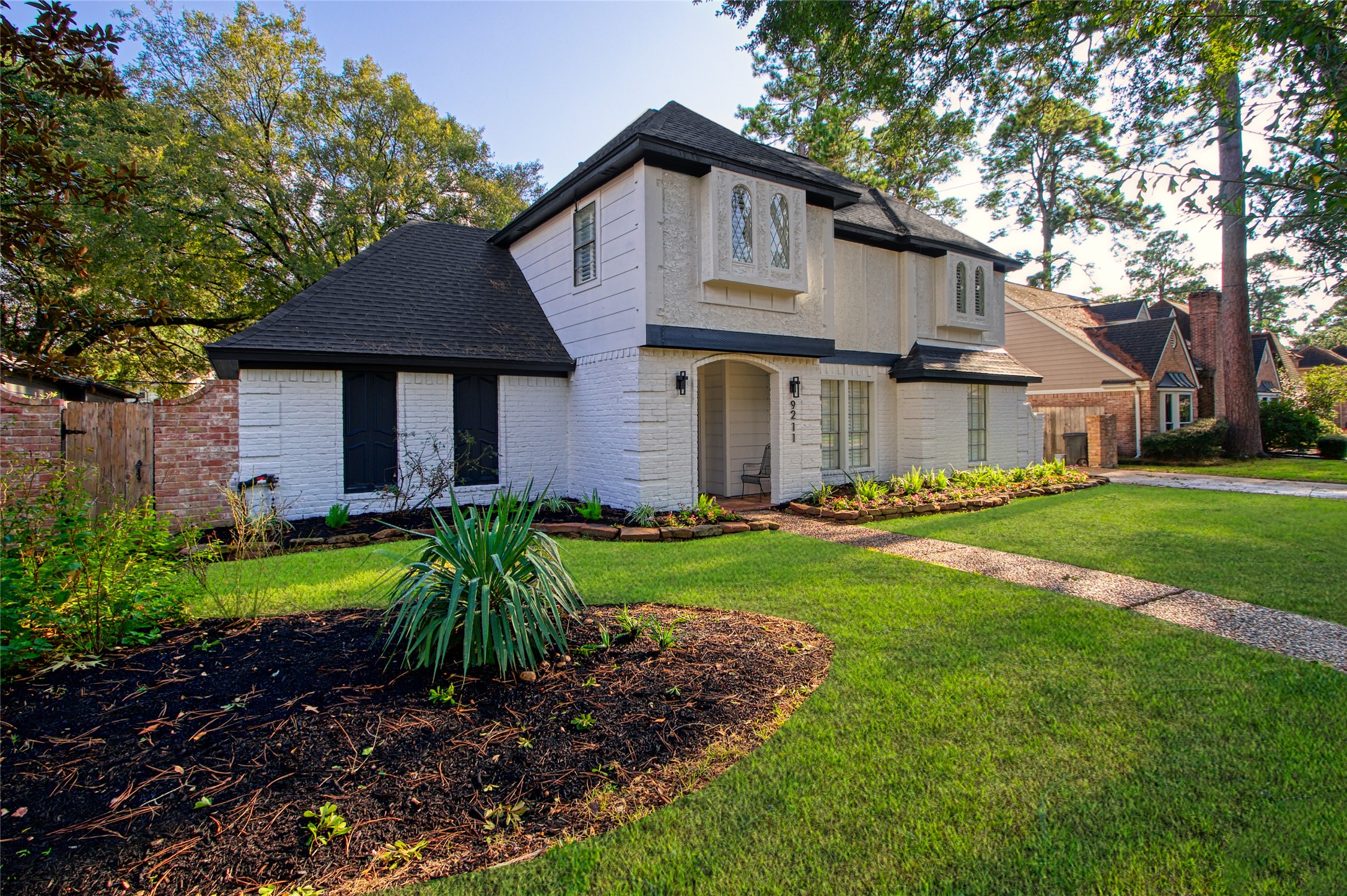 9211 Godstone Lane Spring, TX 77379 - Photo 2 of 30 a front view of a house with garden