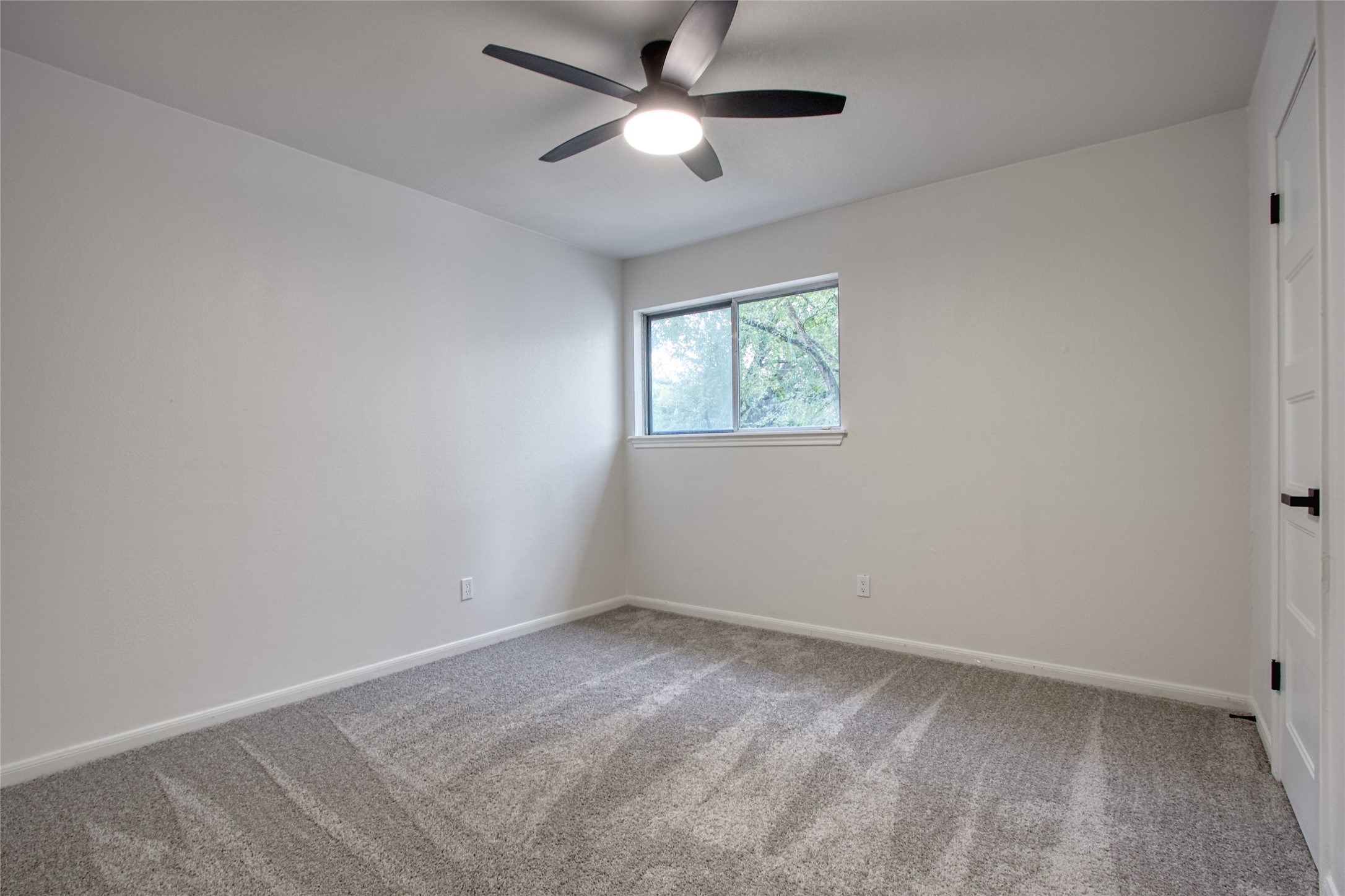 9211 Godstone Lane Spring, TX 77379 - Photo 24 of 30 a view of room with a ceiling fan and window