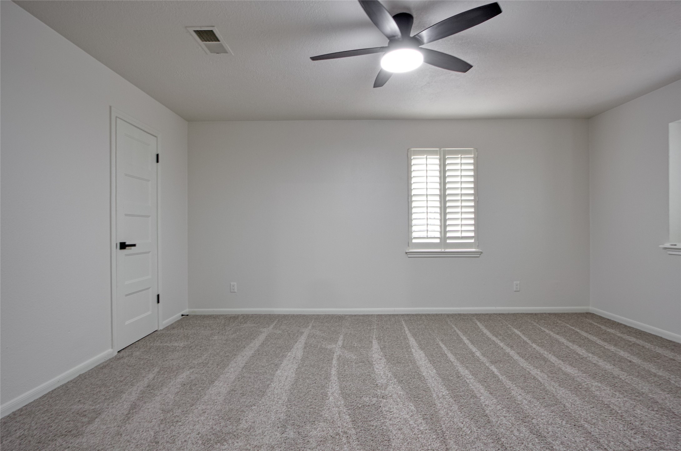 9211 Godstone Lane Spring, TX 77379 - Photo 26 of 30 wooden floor in an empty room with a window
