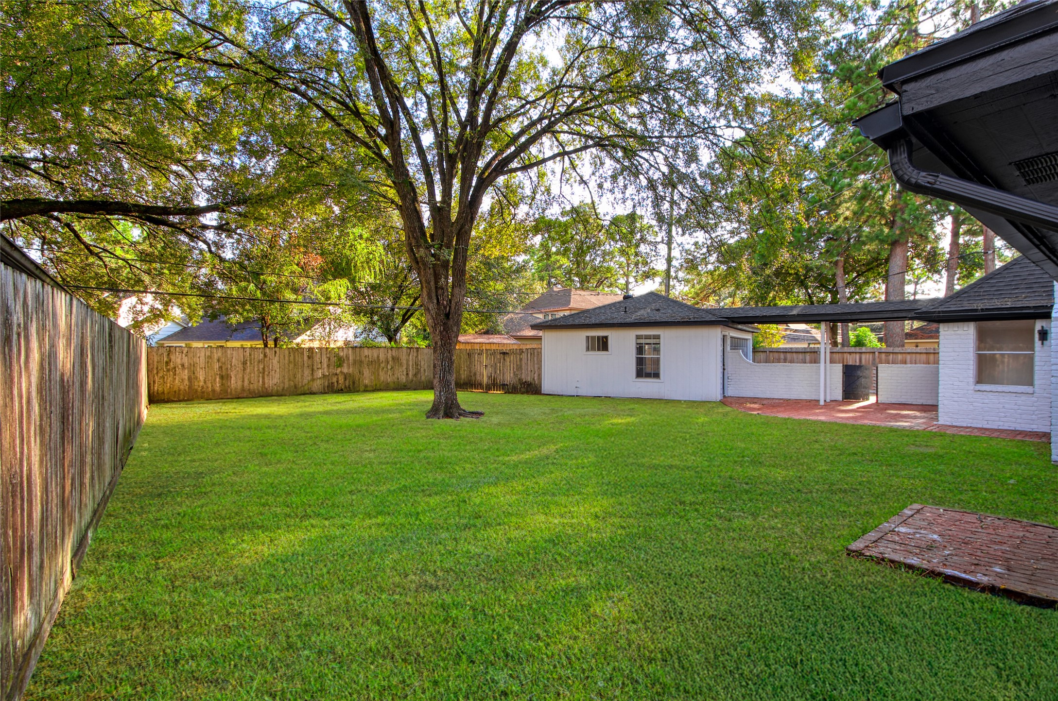 9211 Godstone Lane Spring, TX 77379 - Photo 28 of 30 a view of a yard with a house and a large tree