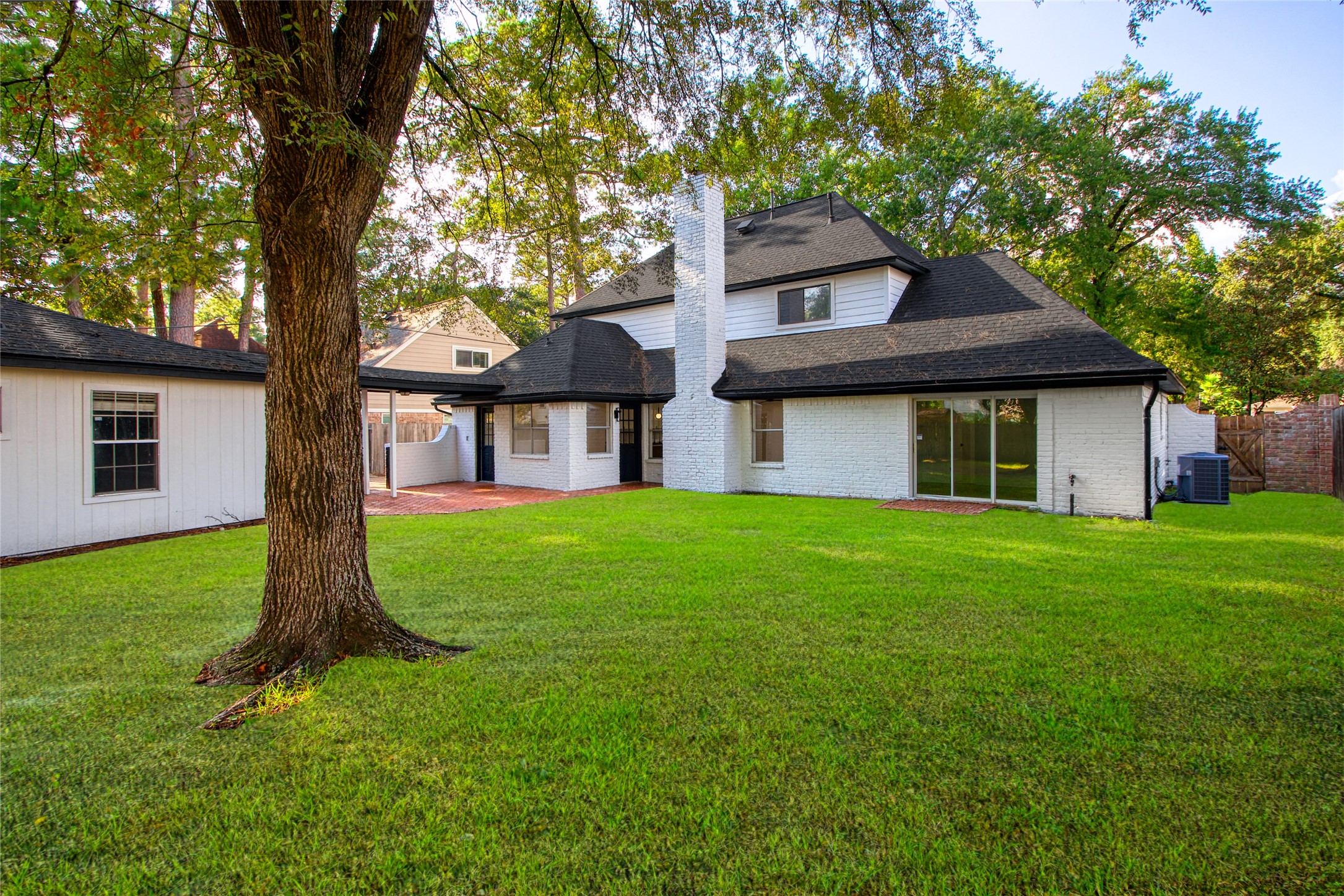 9211 Godstone Lane Spring, TX 77379 - Photo 29 of 30 a front view of a house with a garden and yard