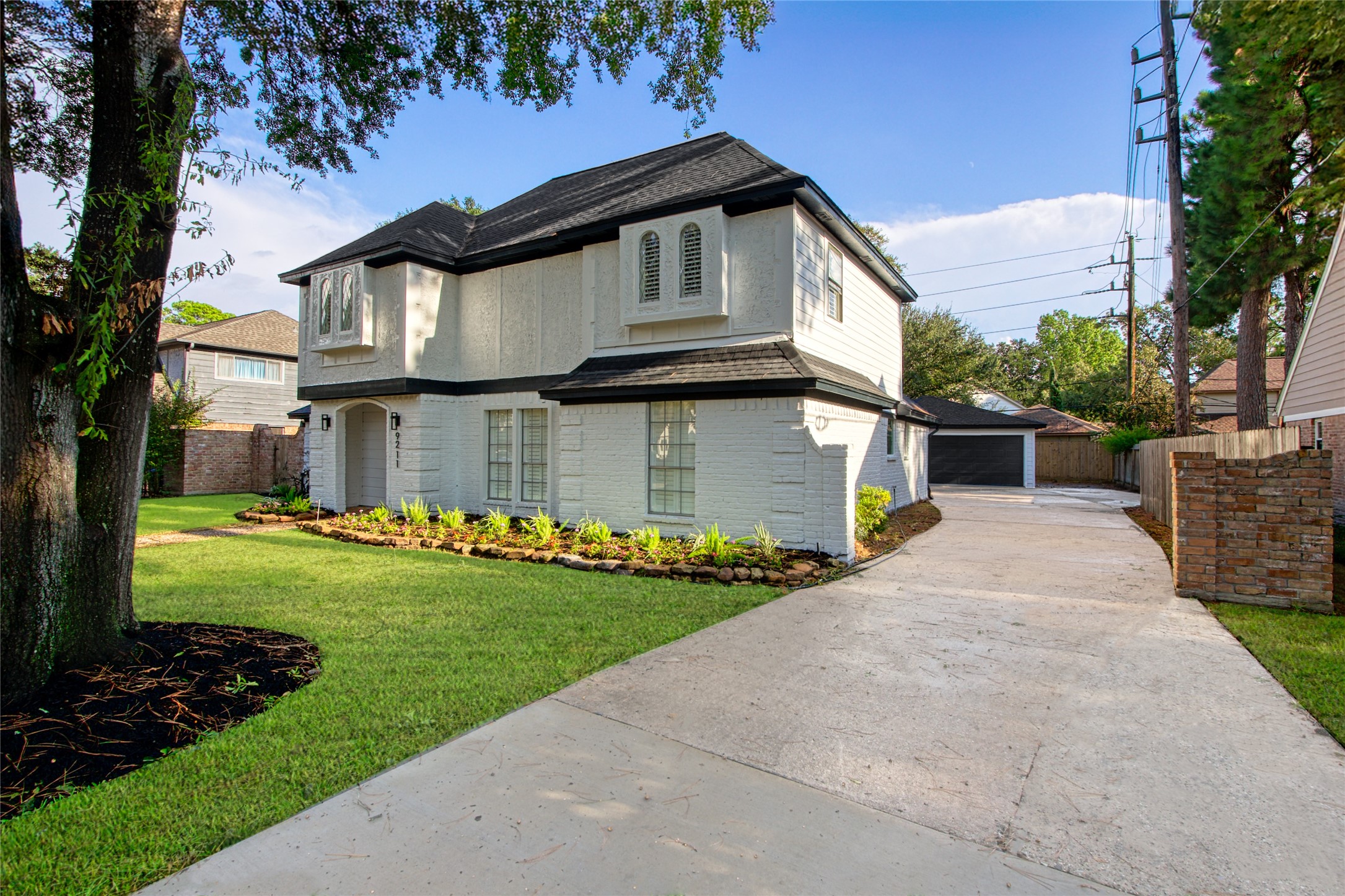9211 Godstone Lane Spring, TX 77379 - Photo 3 of 30 a front view of a house with a yard
