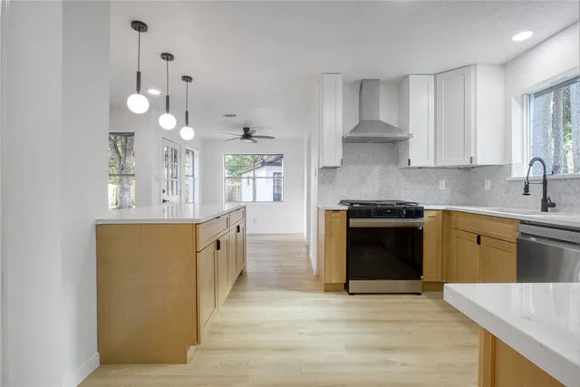 a large kitchen with a stove top oven