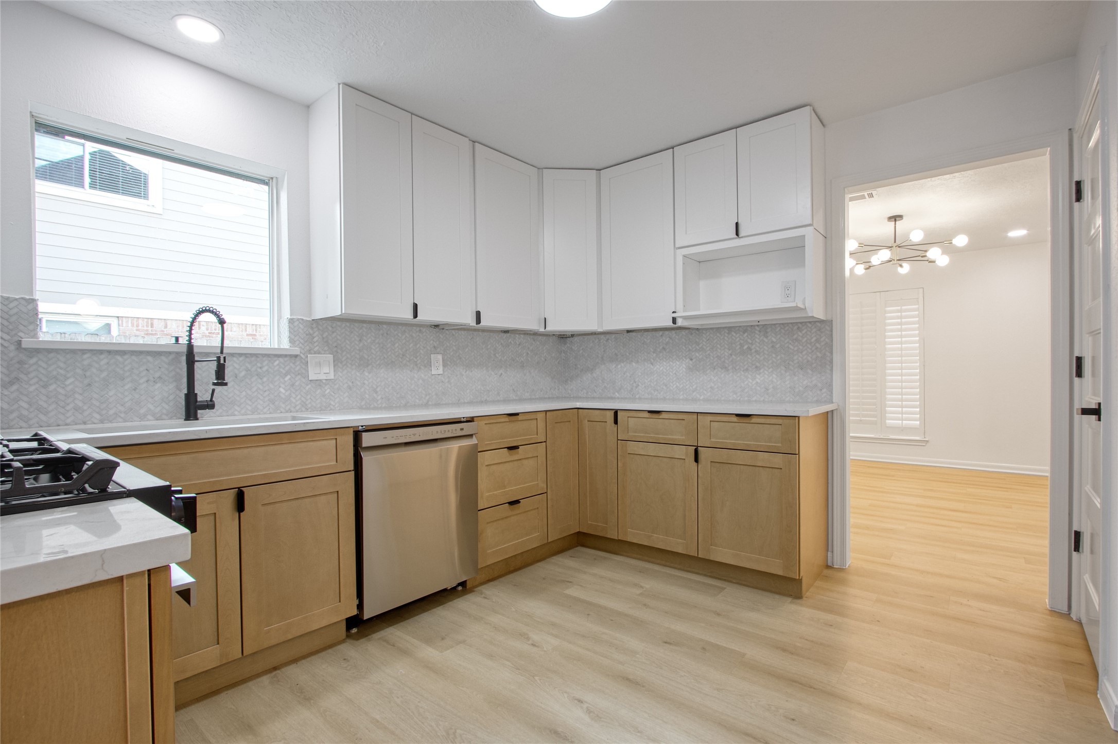 9211 Godstone Lane Spring, TX 77379 - Photo 7 of 30 a kitchen with stainless steel appliances granite countertop a sink stove and cabinets