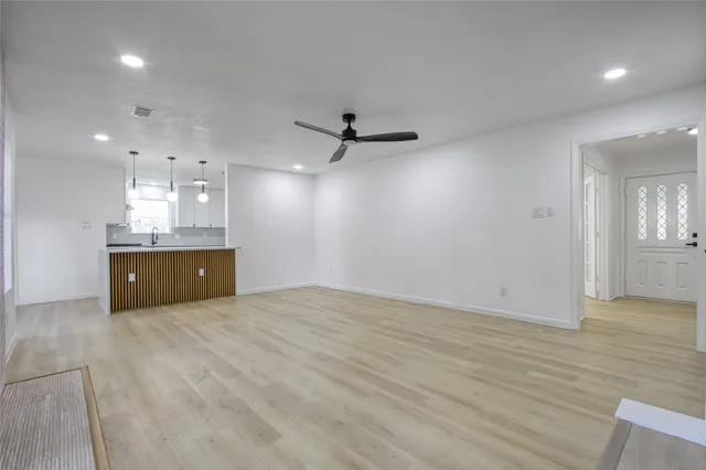 a view of a livingroom with a kitchen