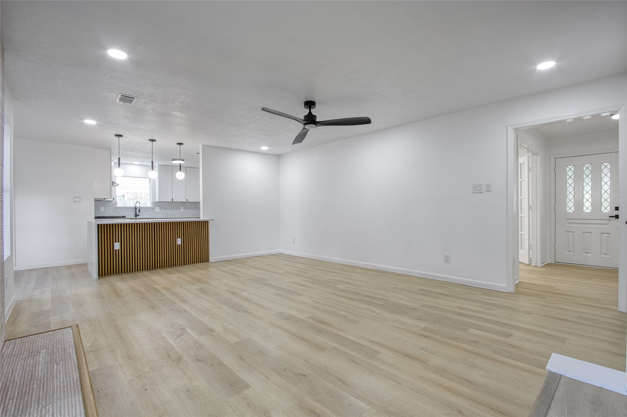 9211 Godstone Lane Spring, TX 77379 - Photo 8 of 30 a view of a livingroom with a kitchen