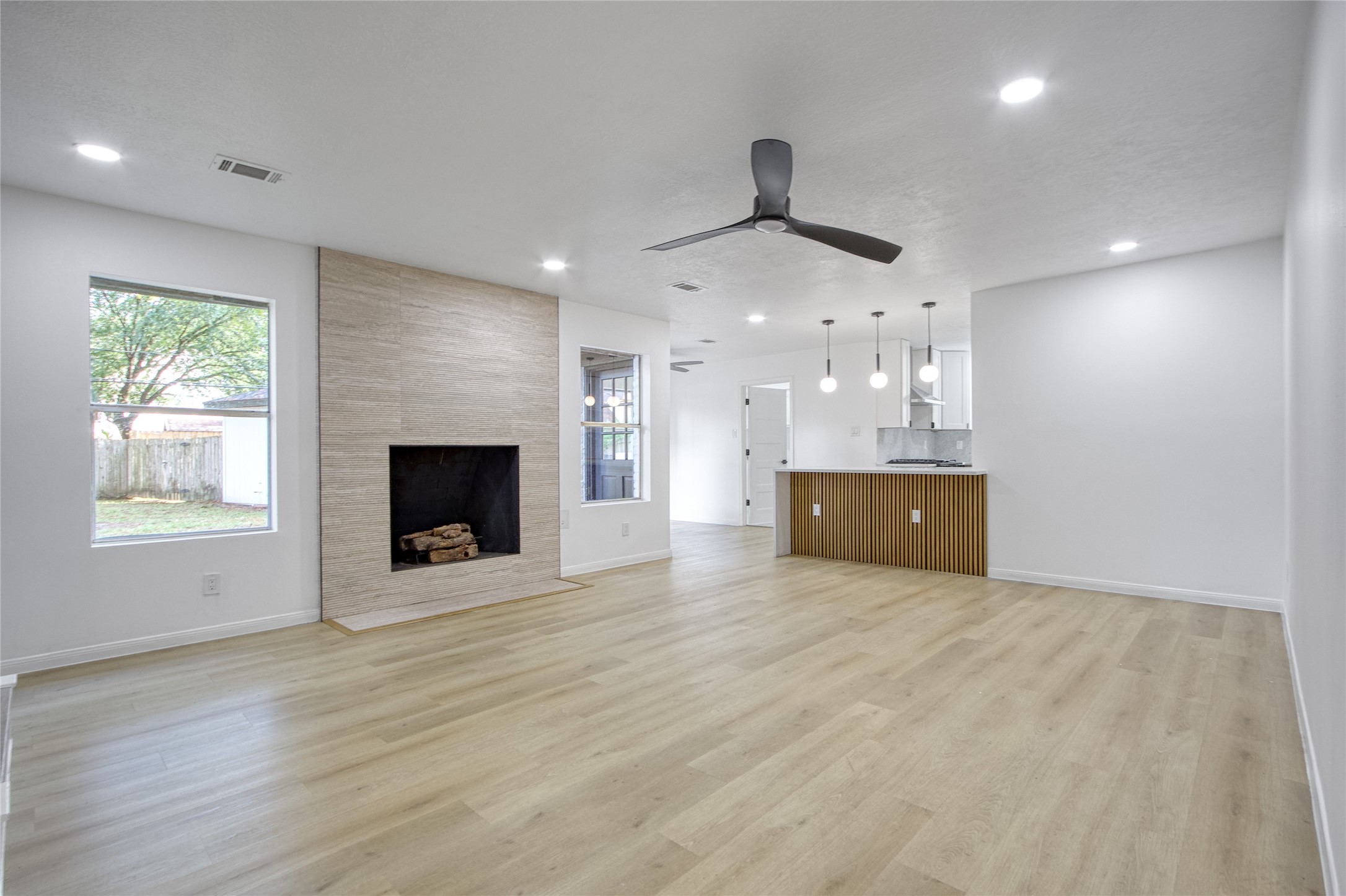 9211 Godstone Lane Spring, TX 77379 - Photo 9 of 30 a view of an empty room with a fireplace and a window