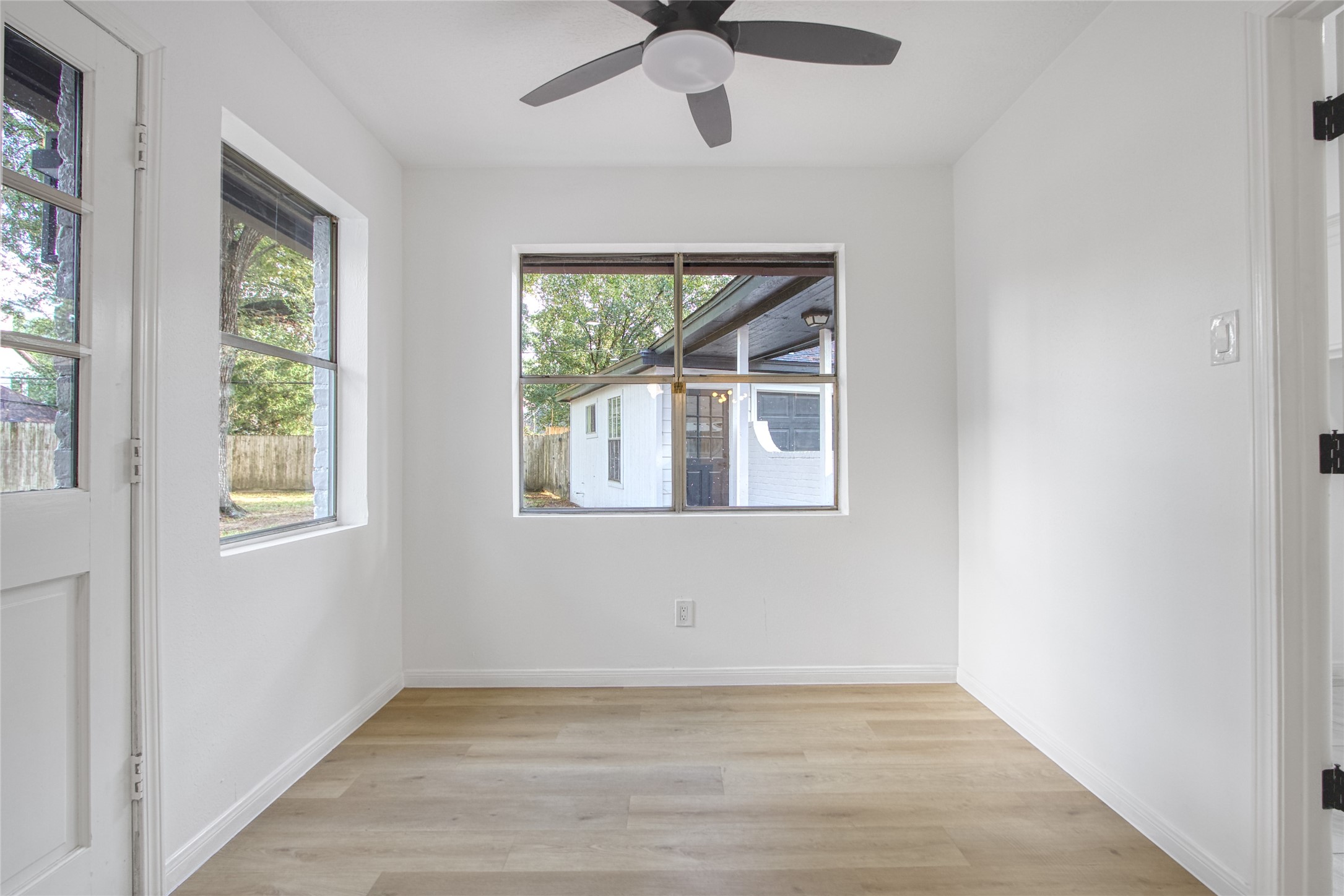 9211 Godstone Lane Spring, TX 77379 - Photo 10 of 30 an empty room with wooden floor fan and windows