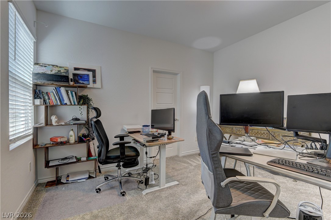 8827 Roadrunner Ravine Street Las Vegas, NV 89166 - Photo 6 of 17 Office featuring healthy amount of natural light and light colored carpet