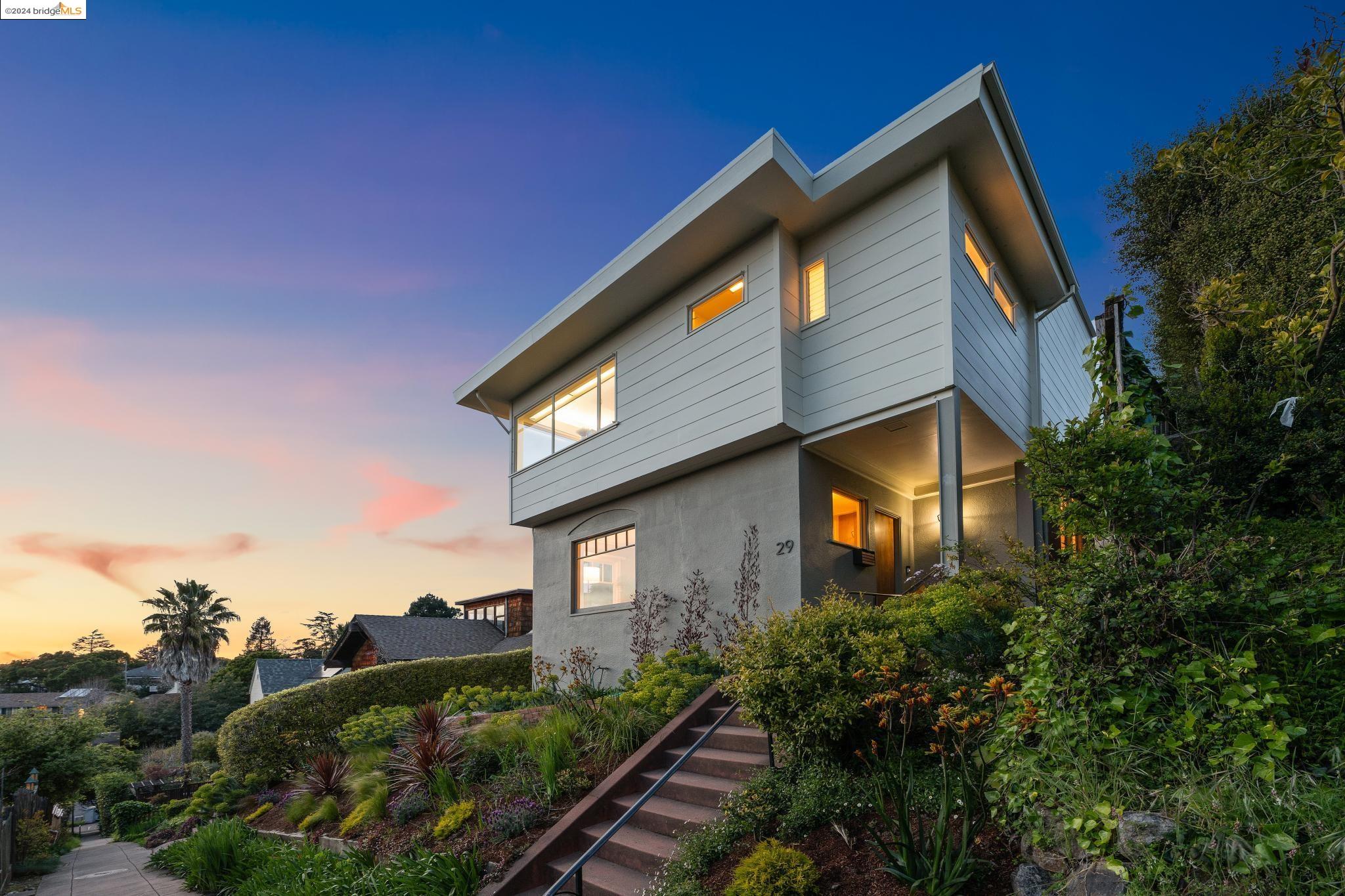 a front view of a house with garden