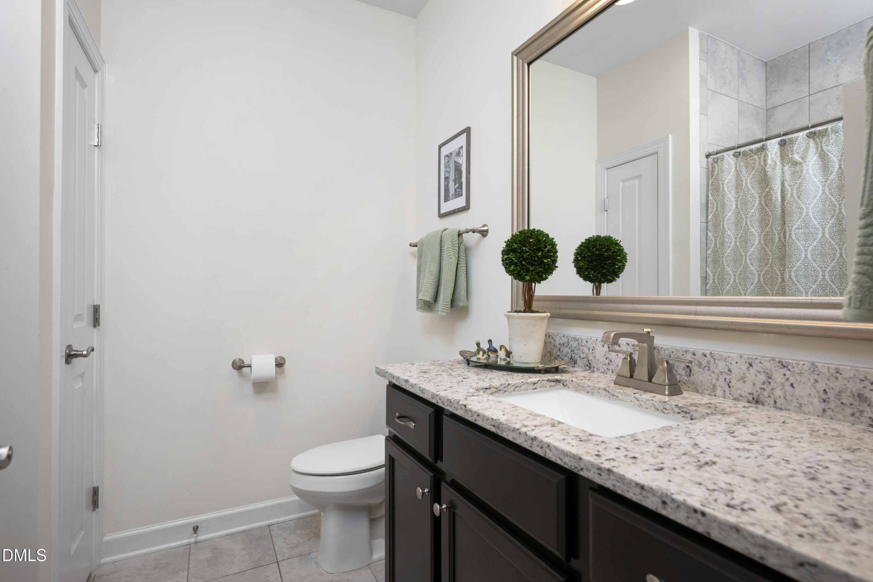 1345 Provision Place Wake Forest, NC 27587 - Photo 11 of 72 a bathroom with a granite countertop sink toilet and mirror