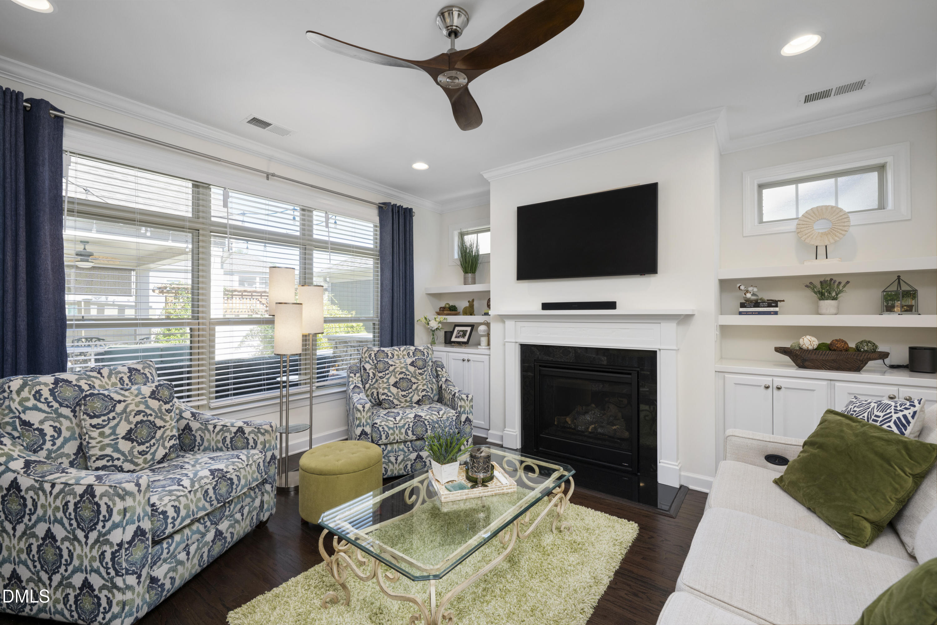 1345 Provision Place Wake Forest, NC 27587 - Photo 14 of 72 a living room with furniture a flat screen tv and a fireplace
