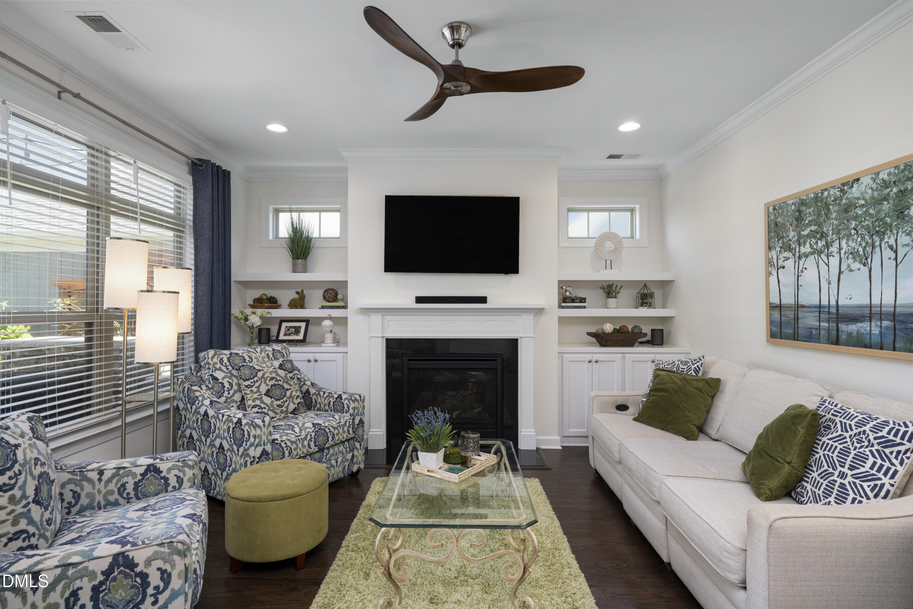 1345 Provision Place Wake Forest, NC 27587 - Photo 15 of 72 a living room with furniture a flat screen tv and a fireplace