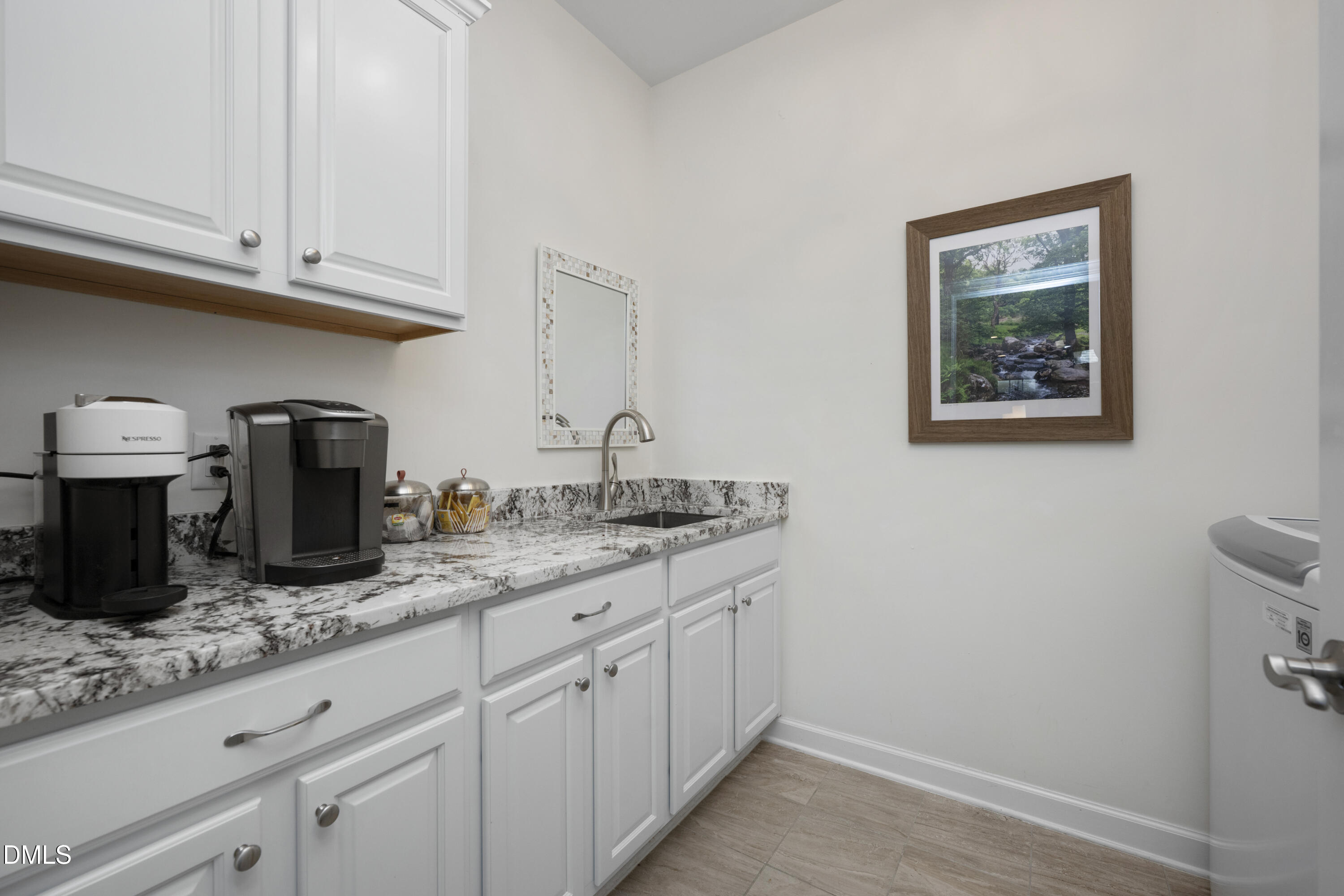 1345 Provision Place Wake Forest, NC 27587 - Photo 32 of 72 a kitchen with granite countertop white cabinets and stainless steel appliances