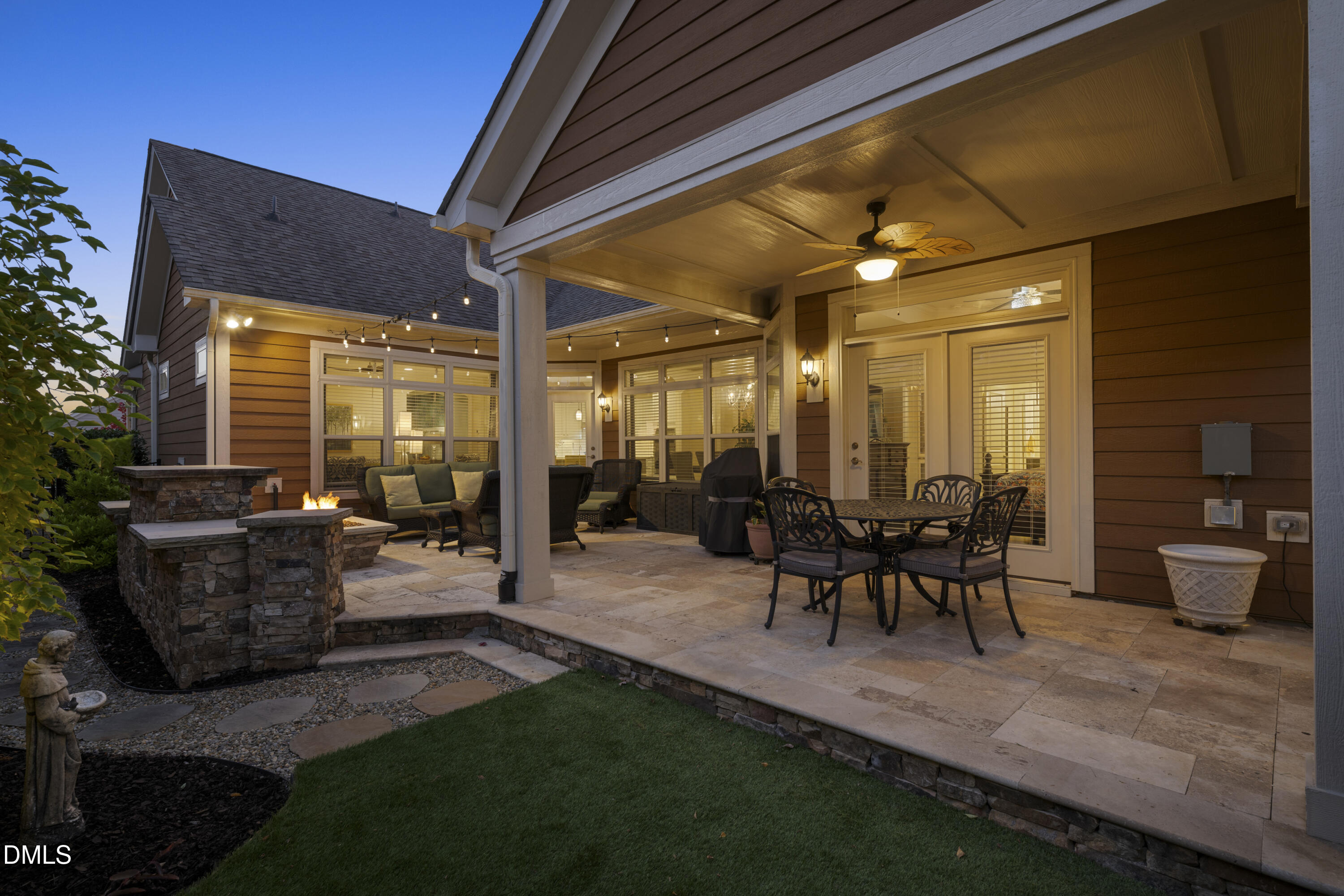 1345 Provision Place Wake Forest, NC 27587 - Photo 3 of 72 a view of a patio with table and chairs and potted plants