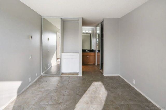 an empty room with a bathroom