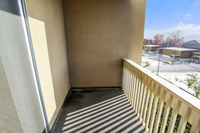 a tennis court with view of tall buildings