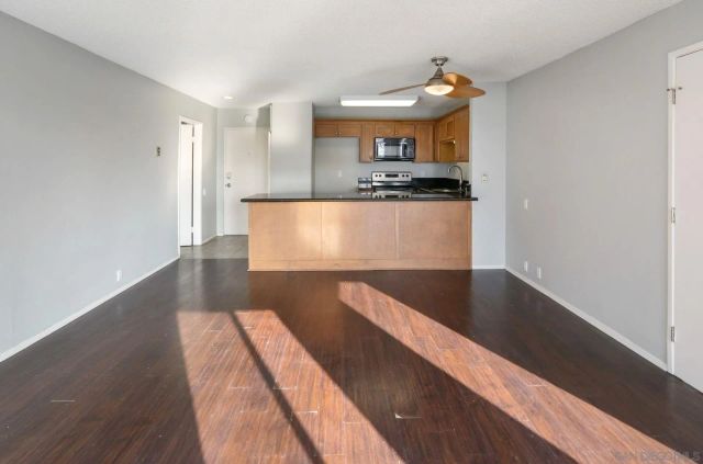 a kitchen with kitchen island a counter top and stove