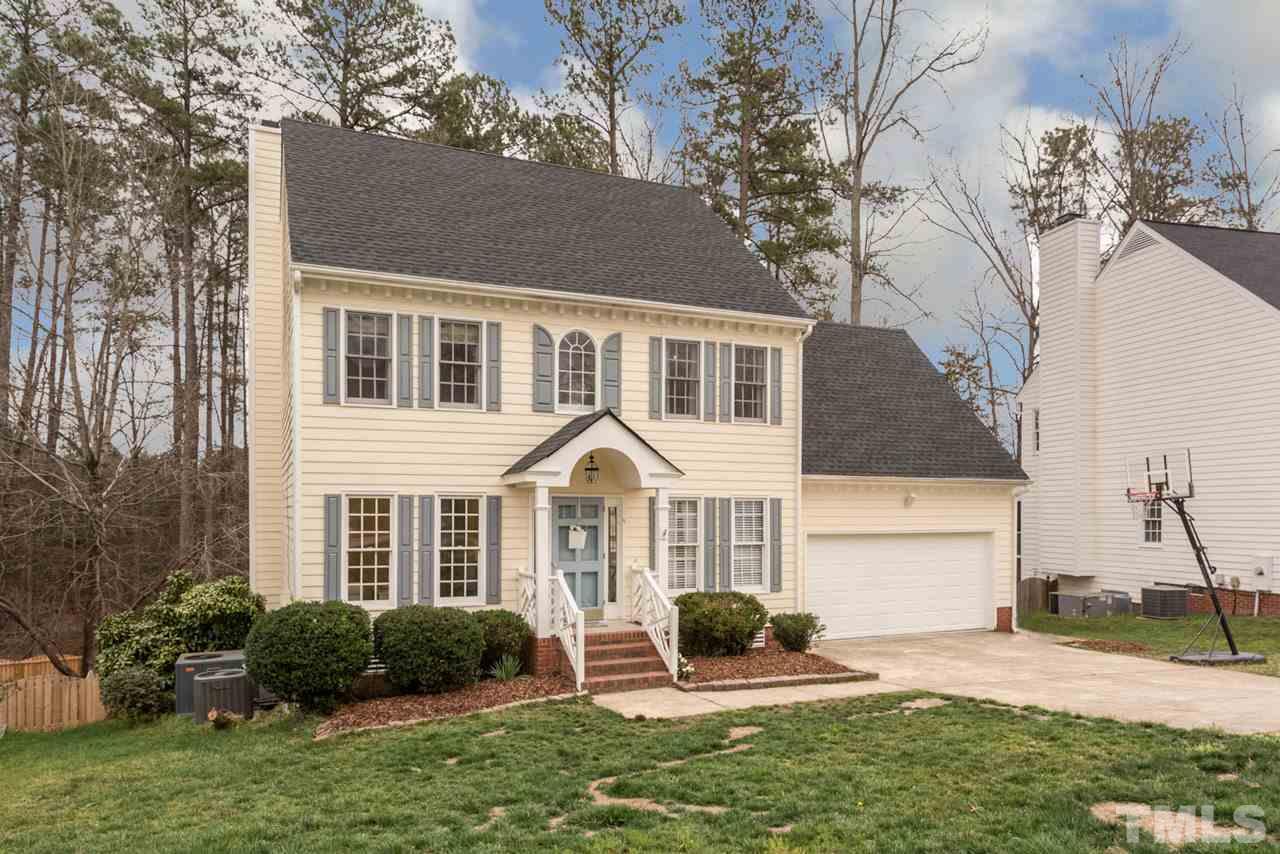 2716 Dahlgreen Road Raleigh, NC 27615 - Photo 2 of 25 a front view of a house with a yard and garage