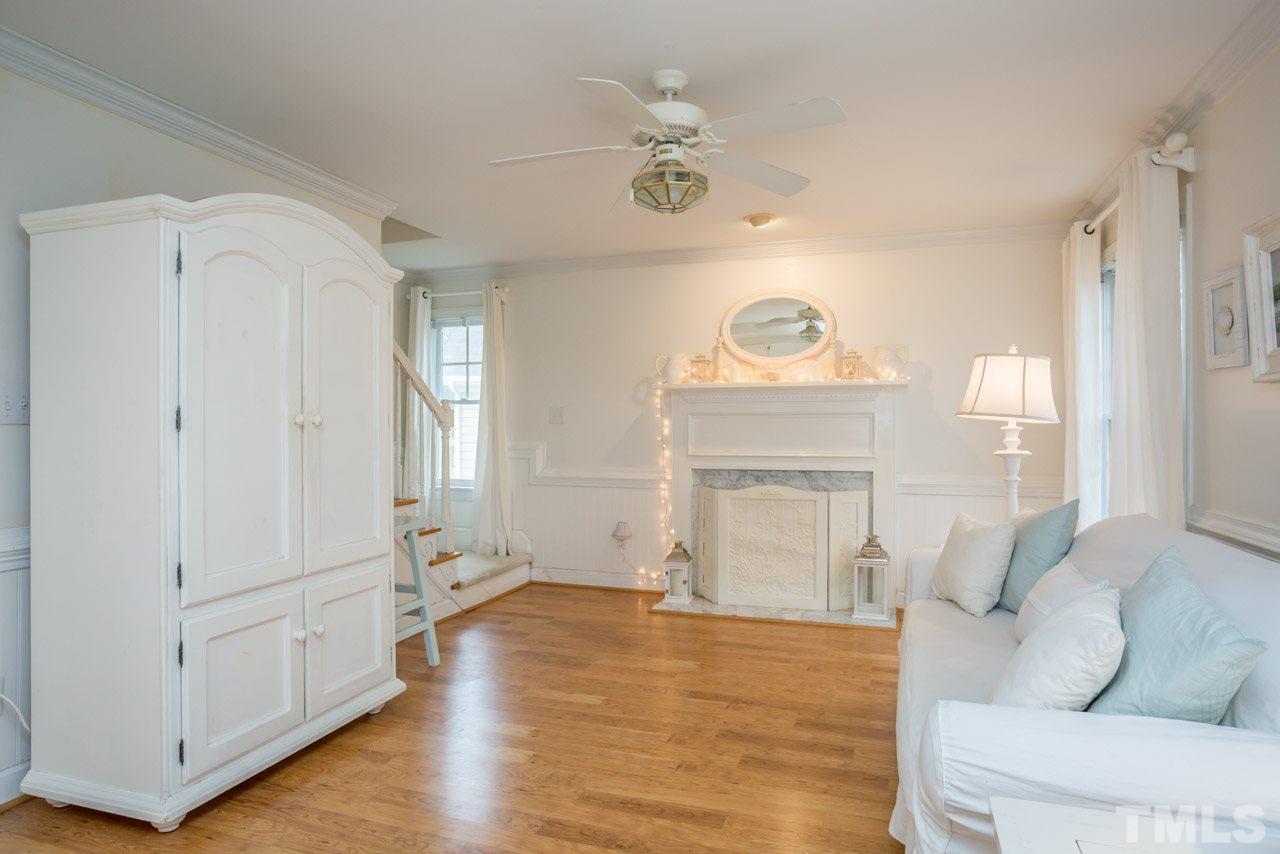 2716 Dahlgreen Road Raleigh, NC 27615 - Photo 13 of 25 a living room with furniture and a fireplace