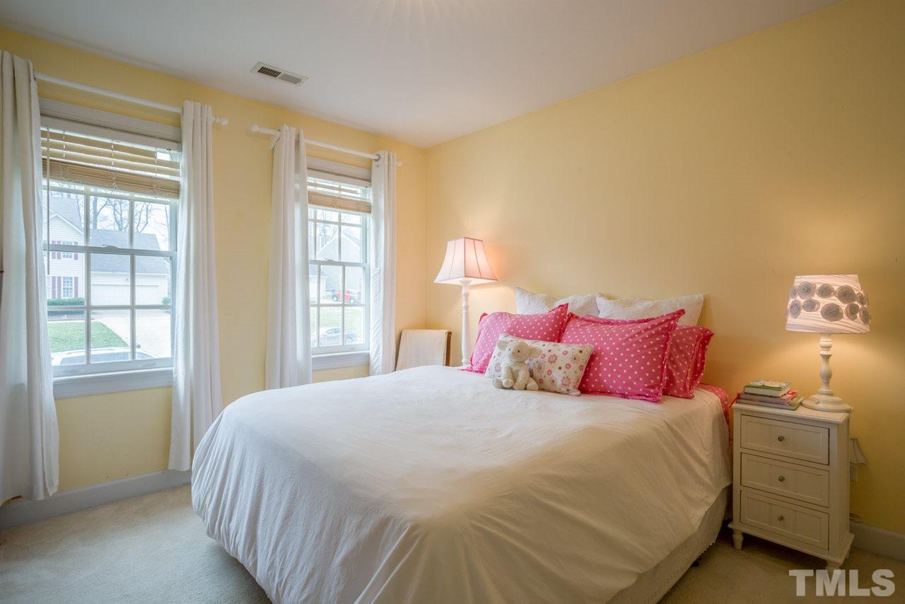 2716 Dahlgreen Road Raleigh, NC 27615 - Photo 16 of 25 a bedroom with a bed and a window