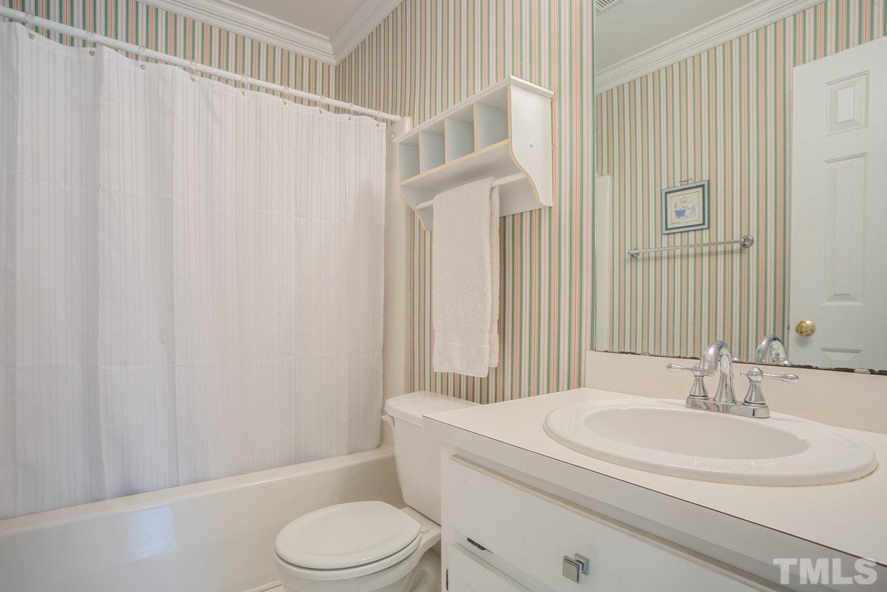 2716 Dahlgreen Road Raleigh, NC 27615 - Photo 17 of 25 a bathroom with a sink toilet and shower
