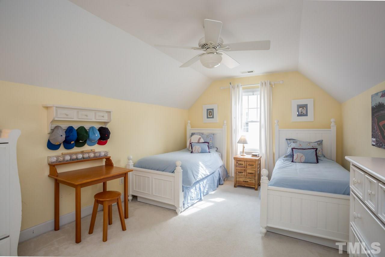 2716 Dahlgreen Road Raleigh, NC 27615 - Photo 19 of 25 a bedroom with a bed and a table