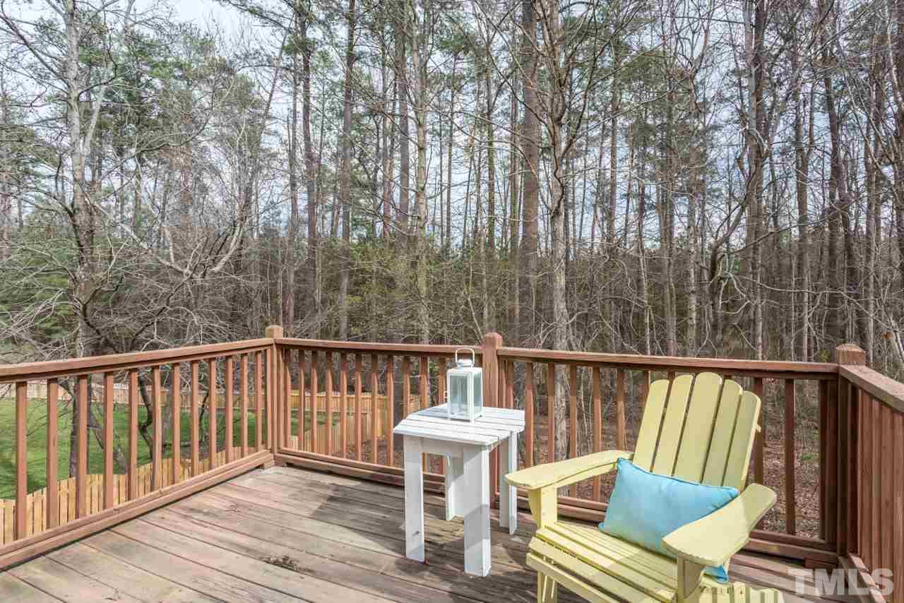 2716 Dahlgreen Road Raleigh, NC 27615 - Photo 23 of 25 a view of a chair and table on the deck