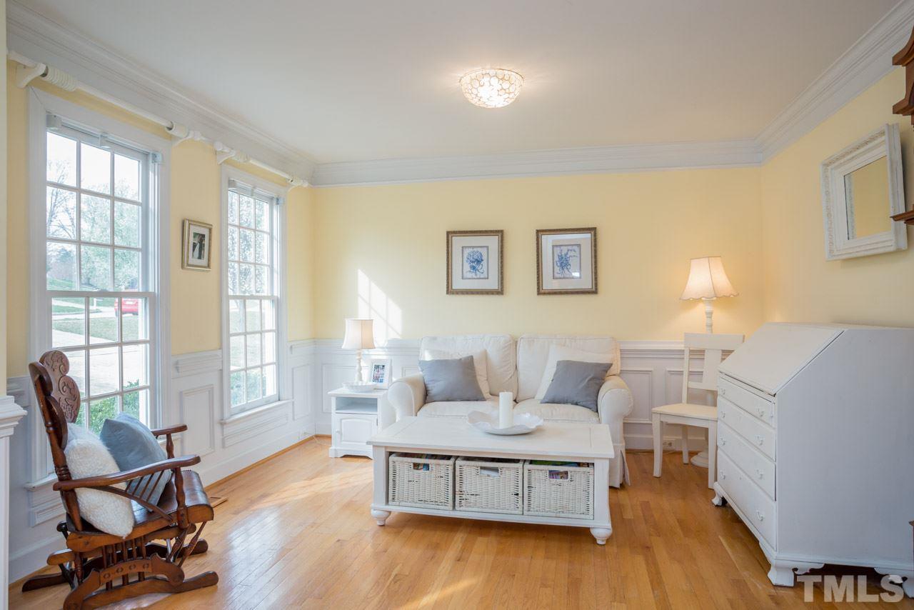 2716 Dahlgreen Road Raleigh, NC 27615 - Photo 6 of 25 a living room with furniture and a wooden floor