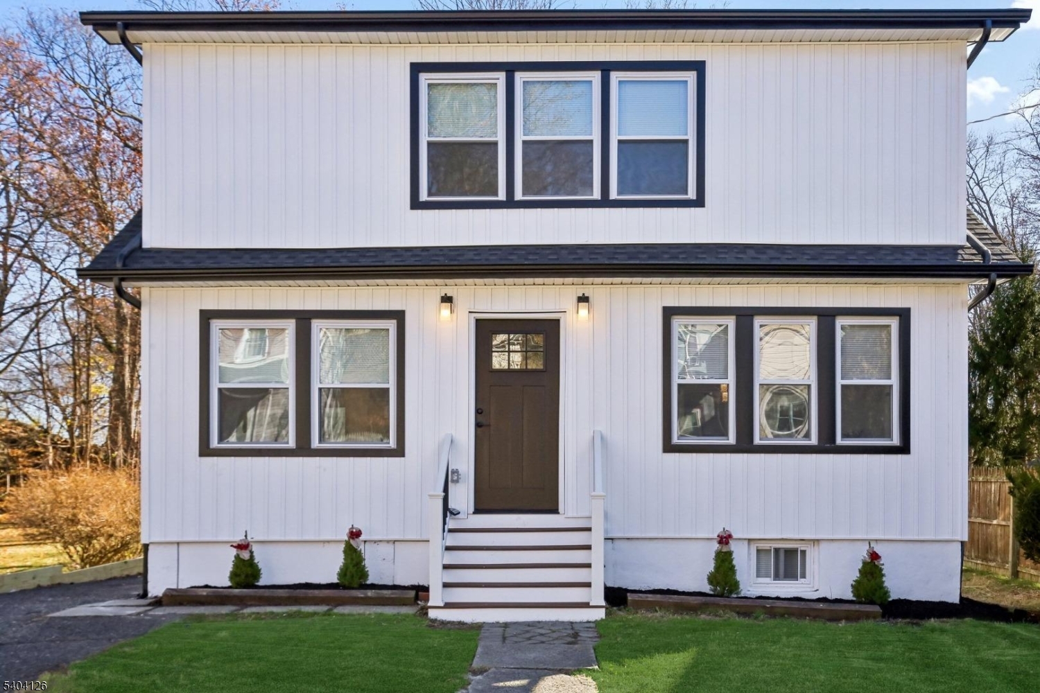85 Madison Street Newton, NJ 07860 - Photo 2 of 45 a front view of a house with a garden