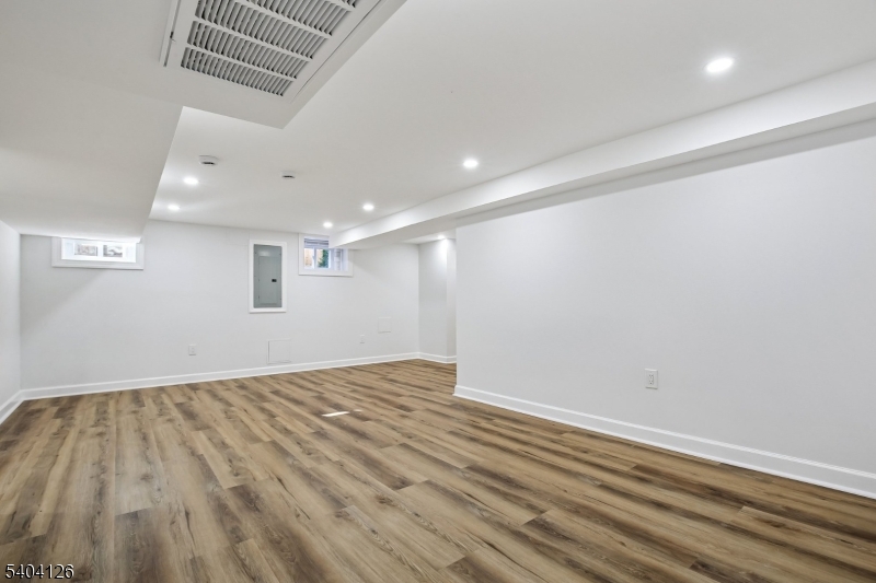 85 Madison Street Newton, NJ 07860 - Photo 38 of 45 an empty room with wooden floor and windows