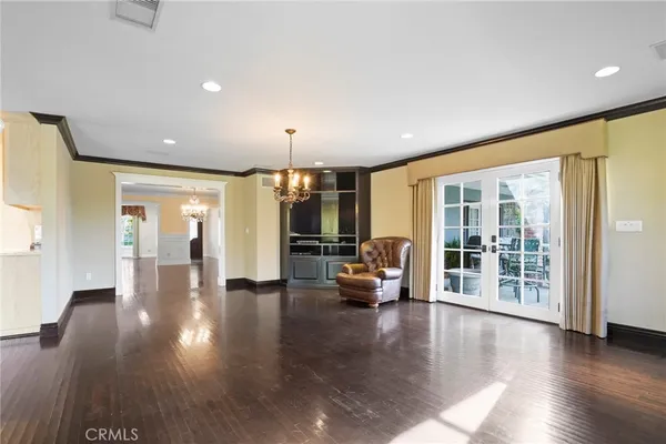 a view of a living room and hall with wooden floor