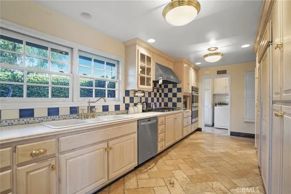 a kitchen with sink and window