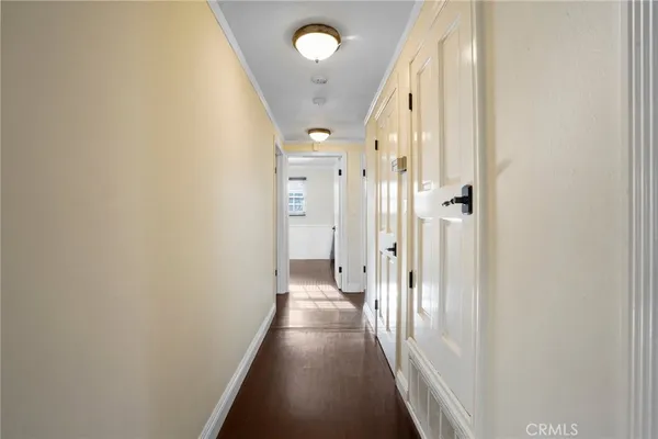 a view of a hallway with a dining area