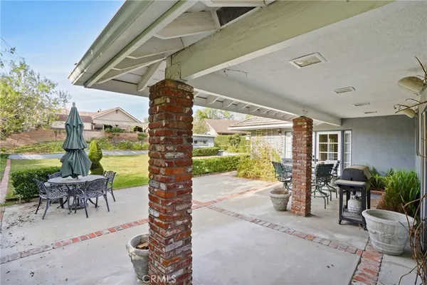 a patio with table and chairs