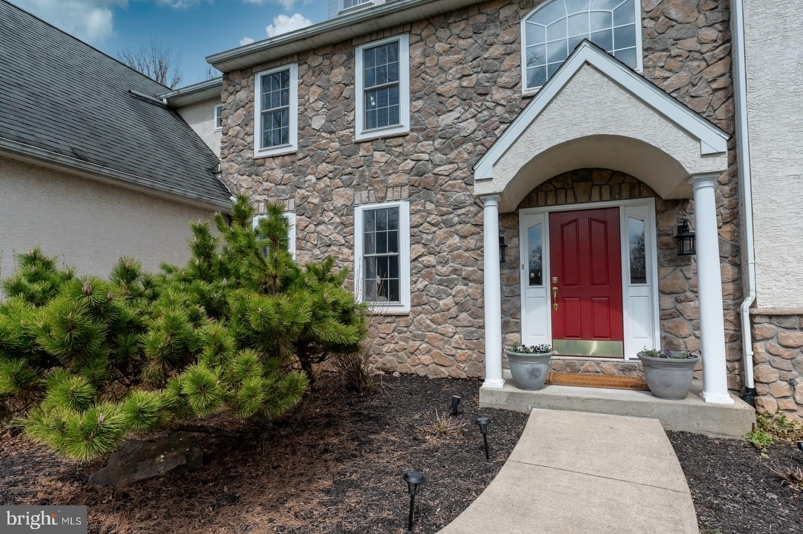 13 Maack Road Pottstown, PA 19465 - Photo 3 of 65 Charming stone entrance with red door.