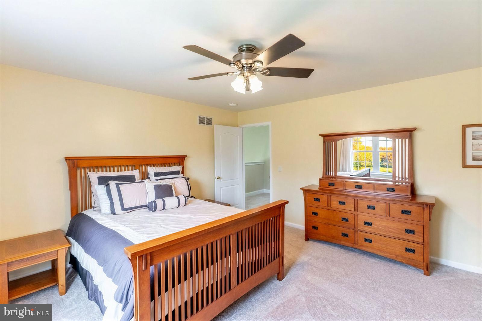 13 Maack Road Pottstown, PA 19465 - Photo 44 of 65 Cozy bedroom with warm wooden accents.