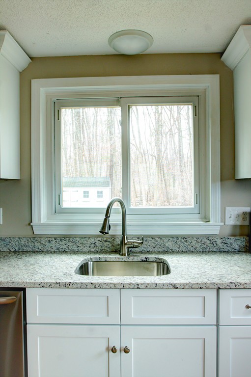 19 Longview Road Chelmsford, MA 01824 - Photo 8 of 30 a kitchen with granite countertop a sink and a window