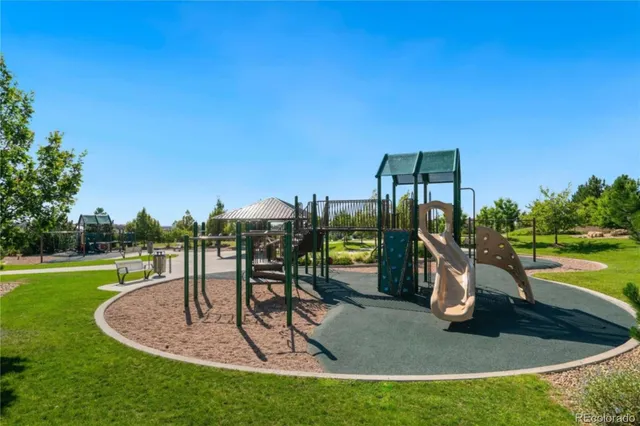 a view of a swimming pool with a yard