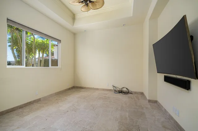 a view of a patio with couches table and chairs and potted plants