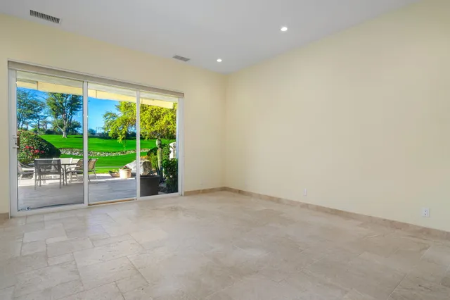 a kitchen with a stove a sink and a wooden cabinets