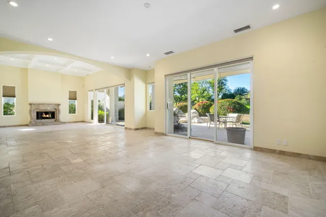 a spacious bathroom with a double vanity sink a mirror and a bathtub