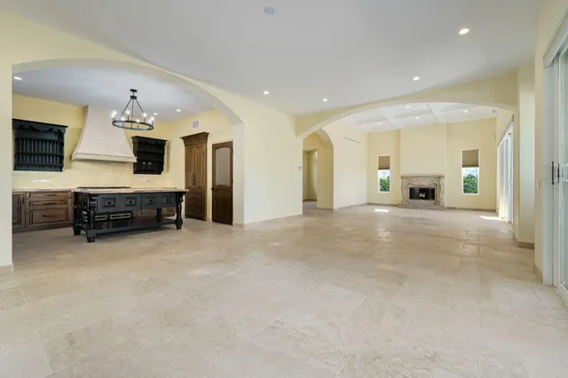 a spacious bathroom with a tub sink and mirror