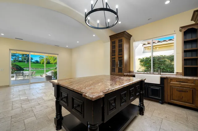a view of a chairs and table in the garden