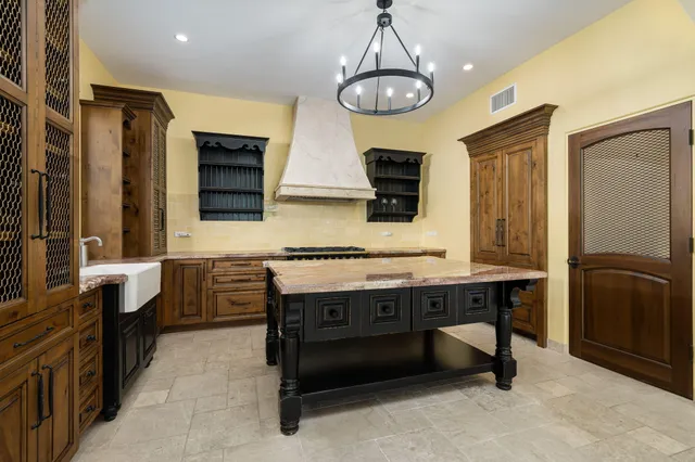 a view of a patio with couches and a table and chairs