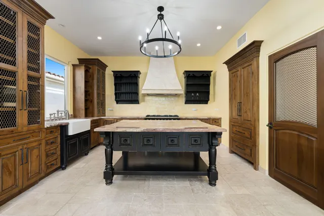 a view of a dinning tables and chairs in a patio of the house