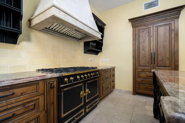 a kitchen with a stove and a sink