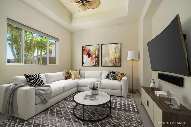 a view of room with window and flat screen tv