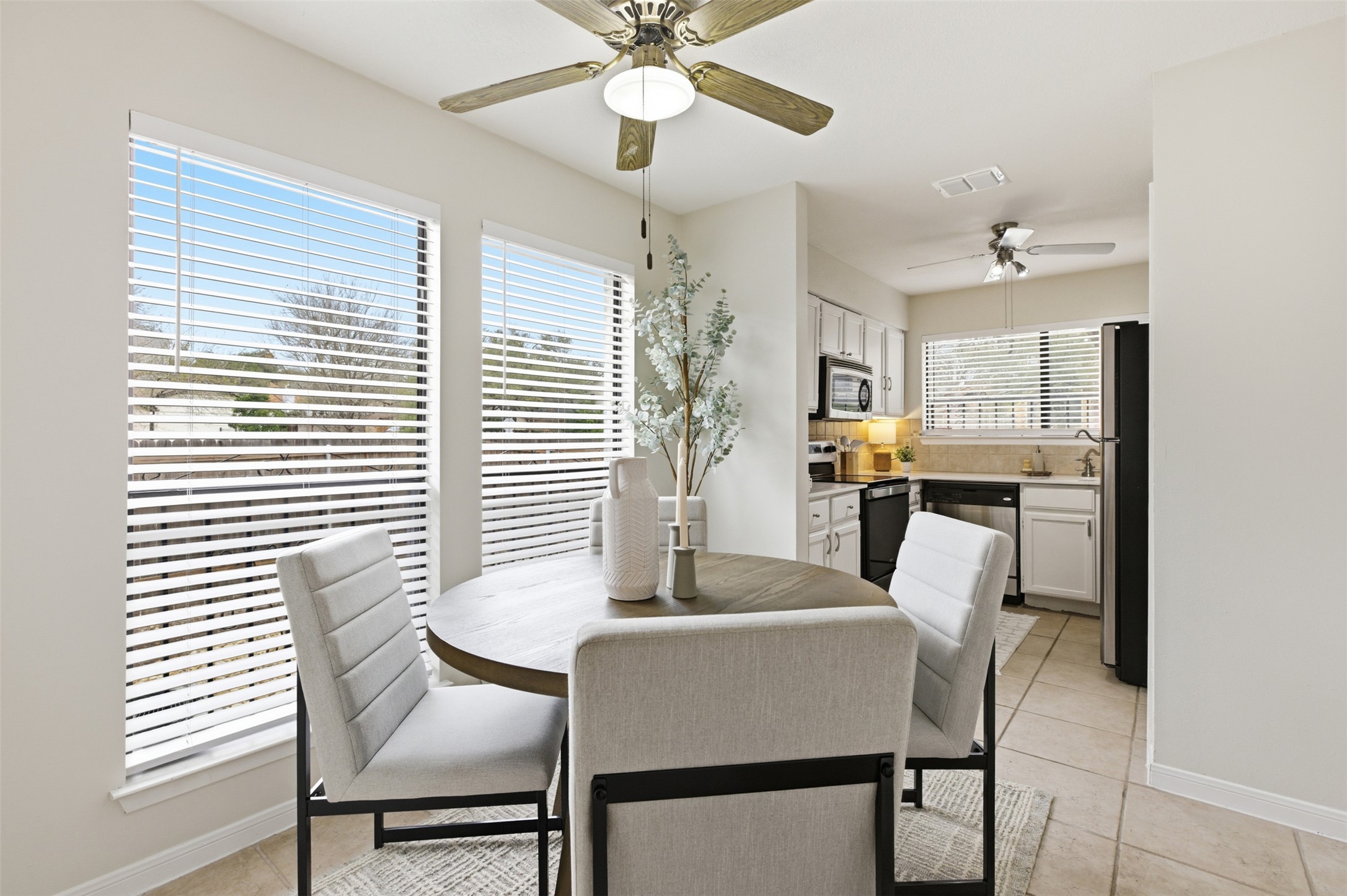 8142 Ceberry Drive, Unit B Austin, TX 78759 - Photo 20 of 38 a view of a dining room with furniture and window